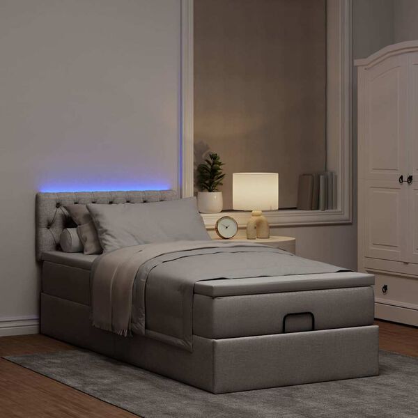 vidaXL Cama otomana con colch&oacute;n y luces LED tela gris taup&eacute; 90x200 cm