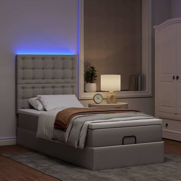 vidaXL Cama otomana con colch&oacute;n y luces LED tela gris taup&eacute; 90x200 cm
