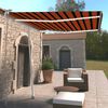 vidaXL Toldo manual retr&aacute;ctil con luz LED naranja y marr&oacute;n 300x250 cm