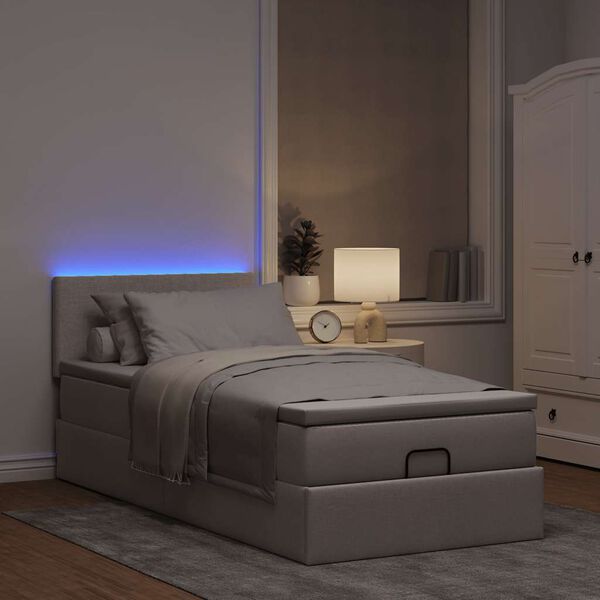 vidaXL Cama otomana con colch&oacute;n y luces LED tela gris taup&eacute; 90x200 cm
