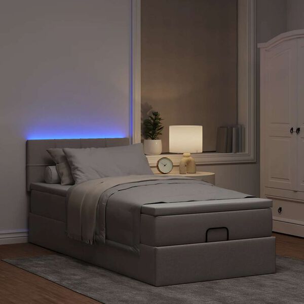 vidaXL Cama otomana con colch&oacute;n y luces LED tela gris taup&eacute; 90x200 cm